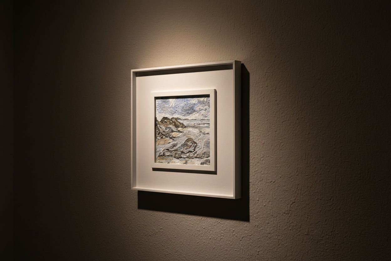 Framed artwork on a dark wall